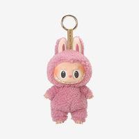 Pink plush keychain with bunny ears on a white background